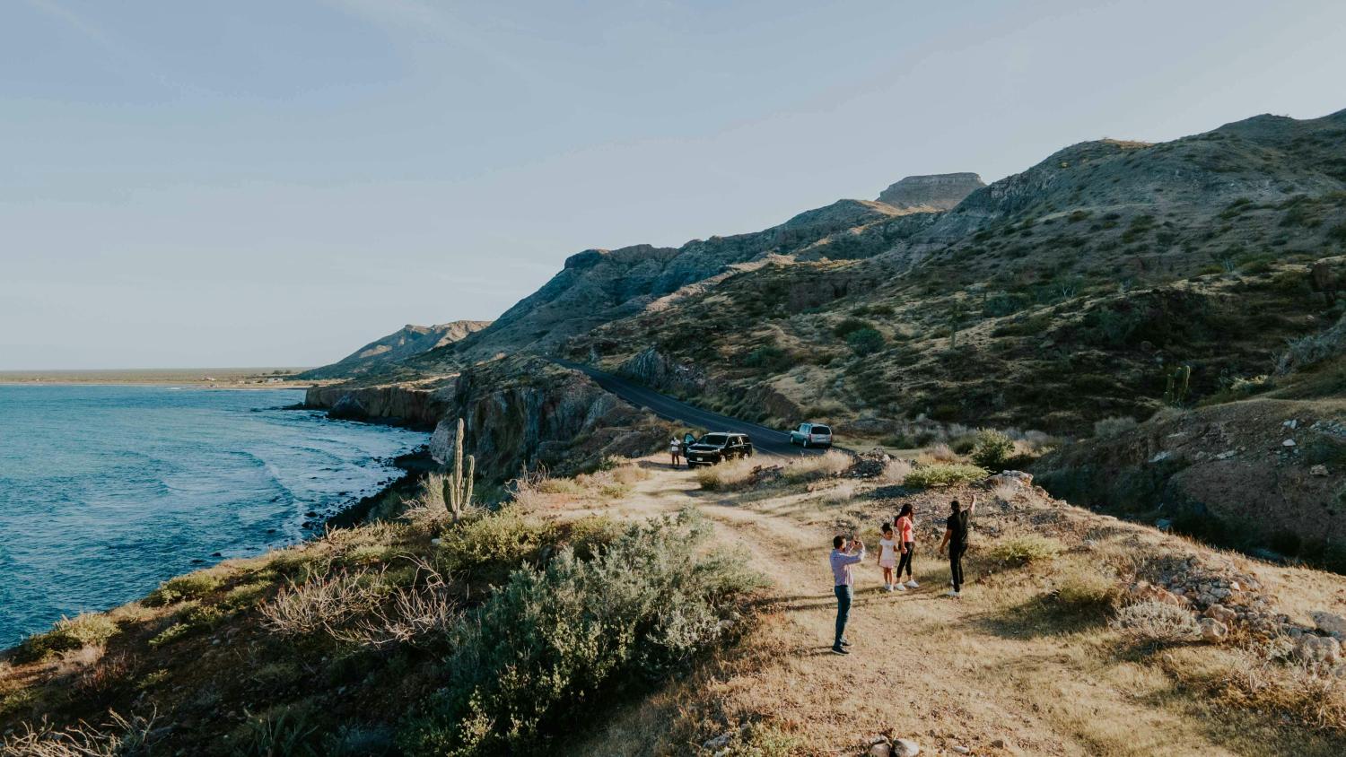 People on a rocky coast.