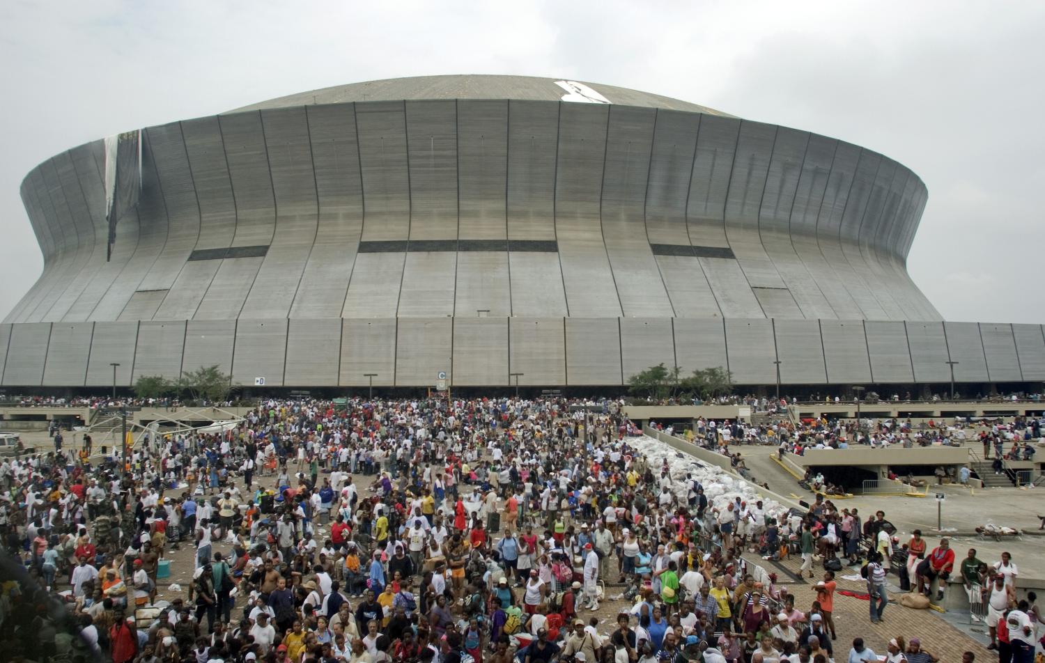 New Orleans residents line up outside the Superdome in New Orleans