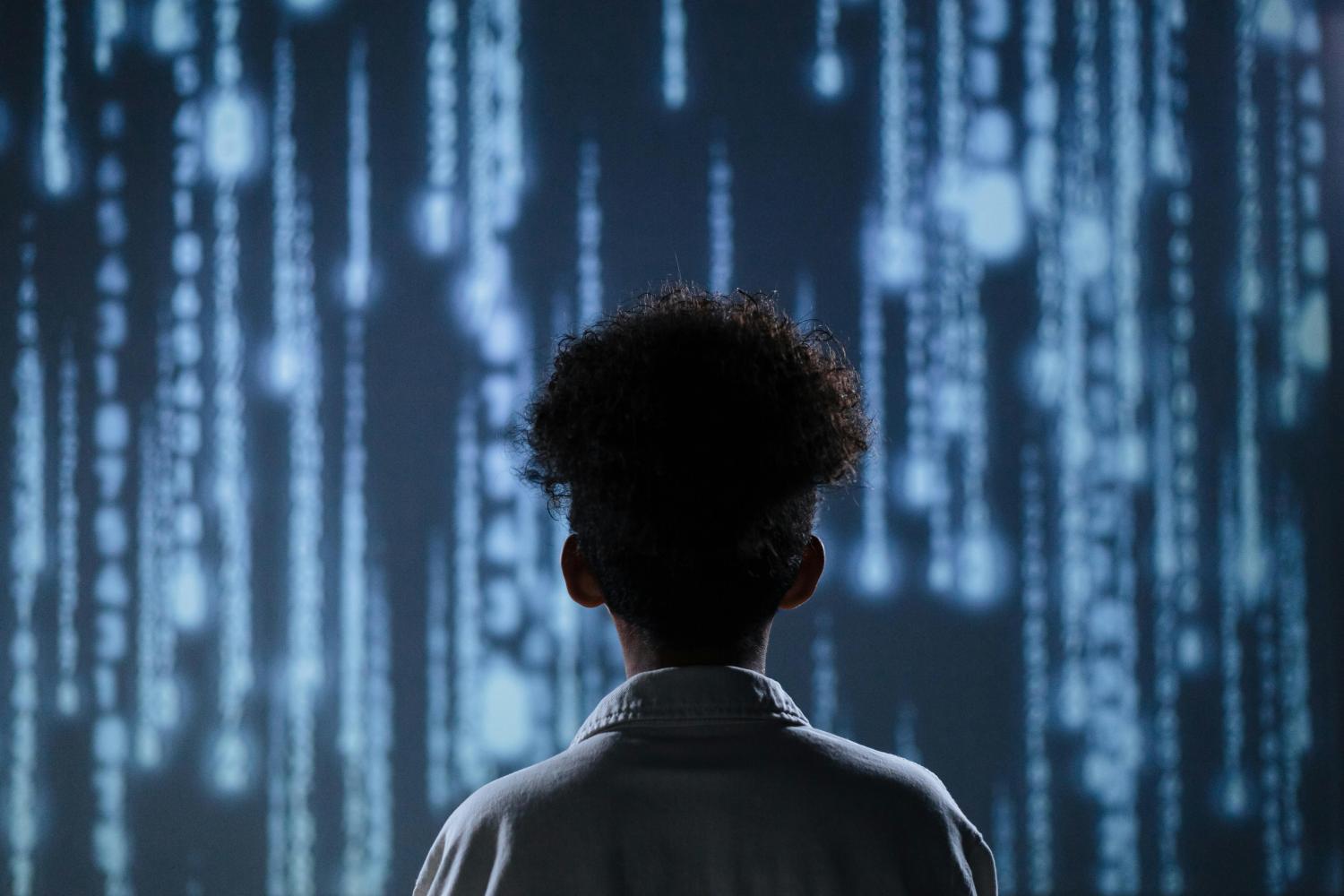 child looking at code
