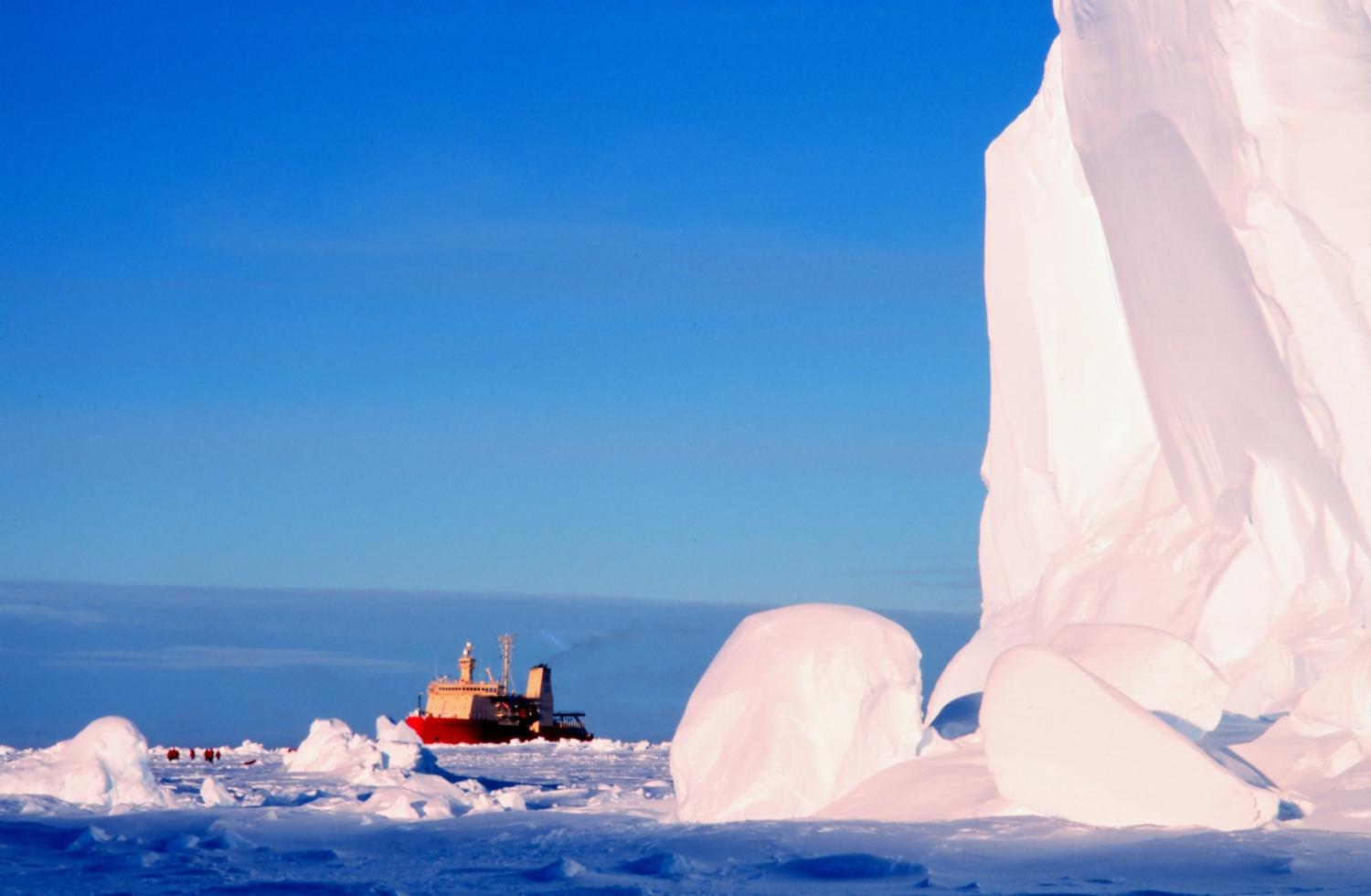 The ice breaker next to a large ice shelf