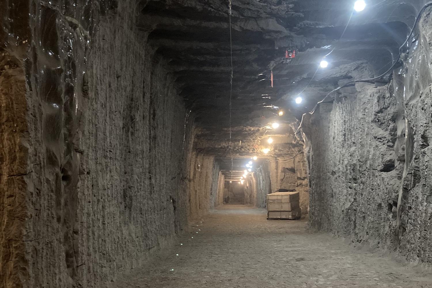 Photo of underground tunnel with lights overhead