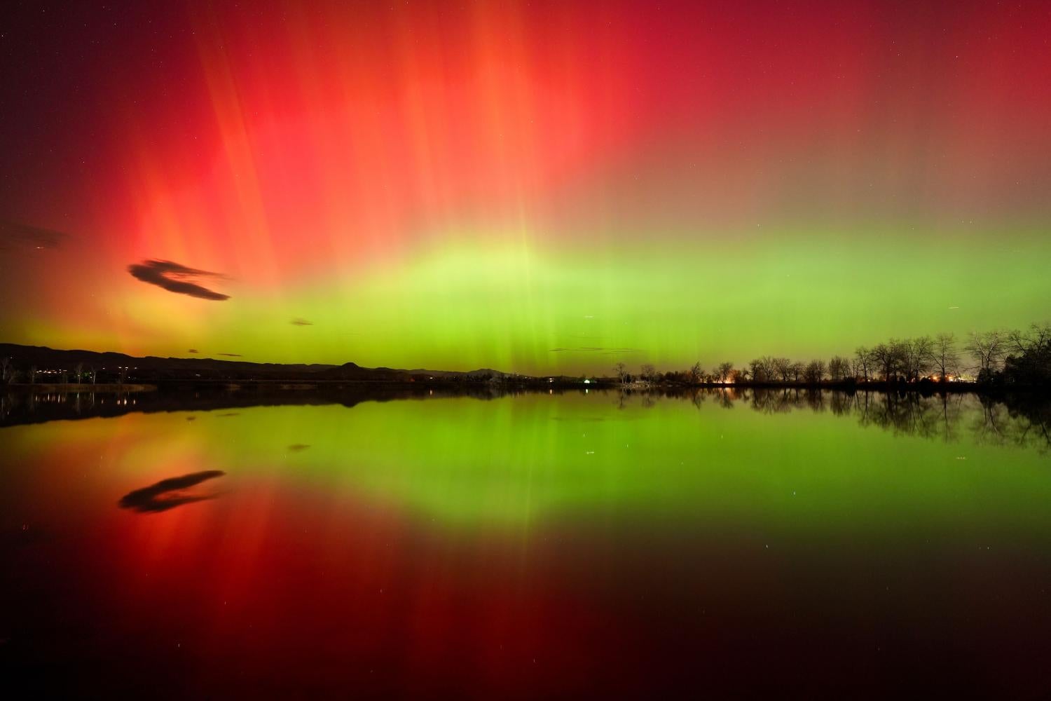 Green and red glowing skies reflected in a lake
