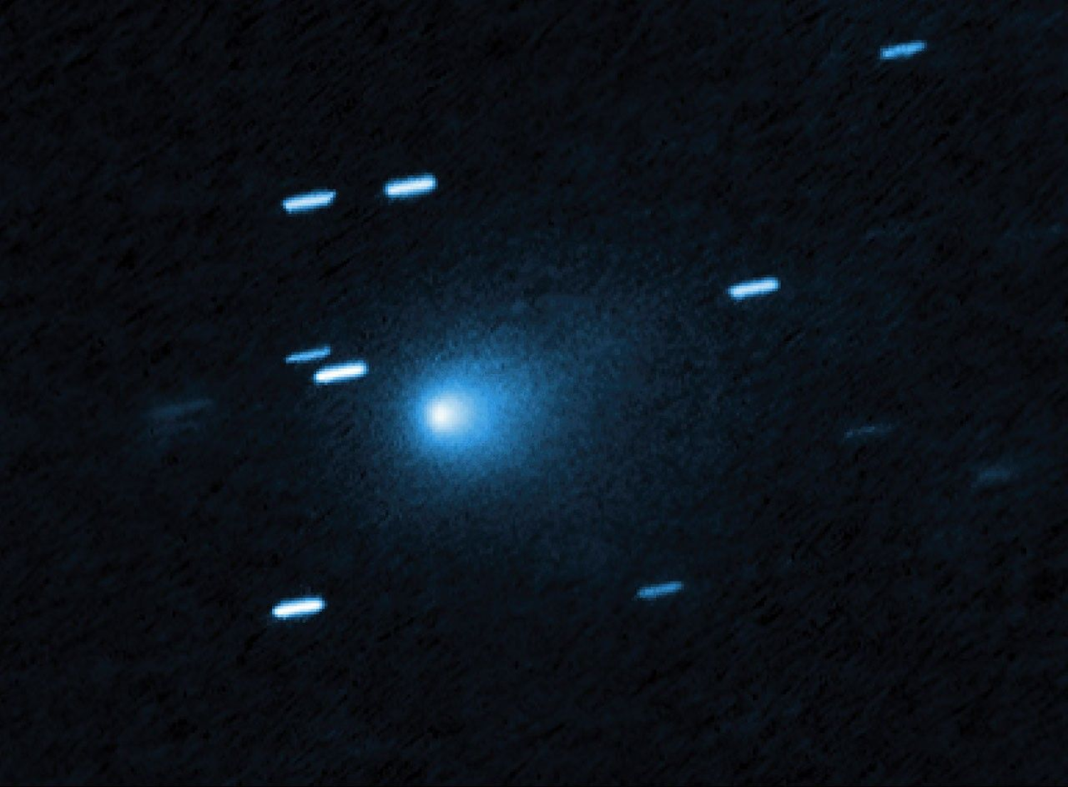Image showing a fuzzy comet moving through space