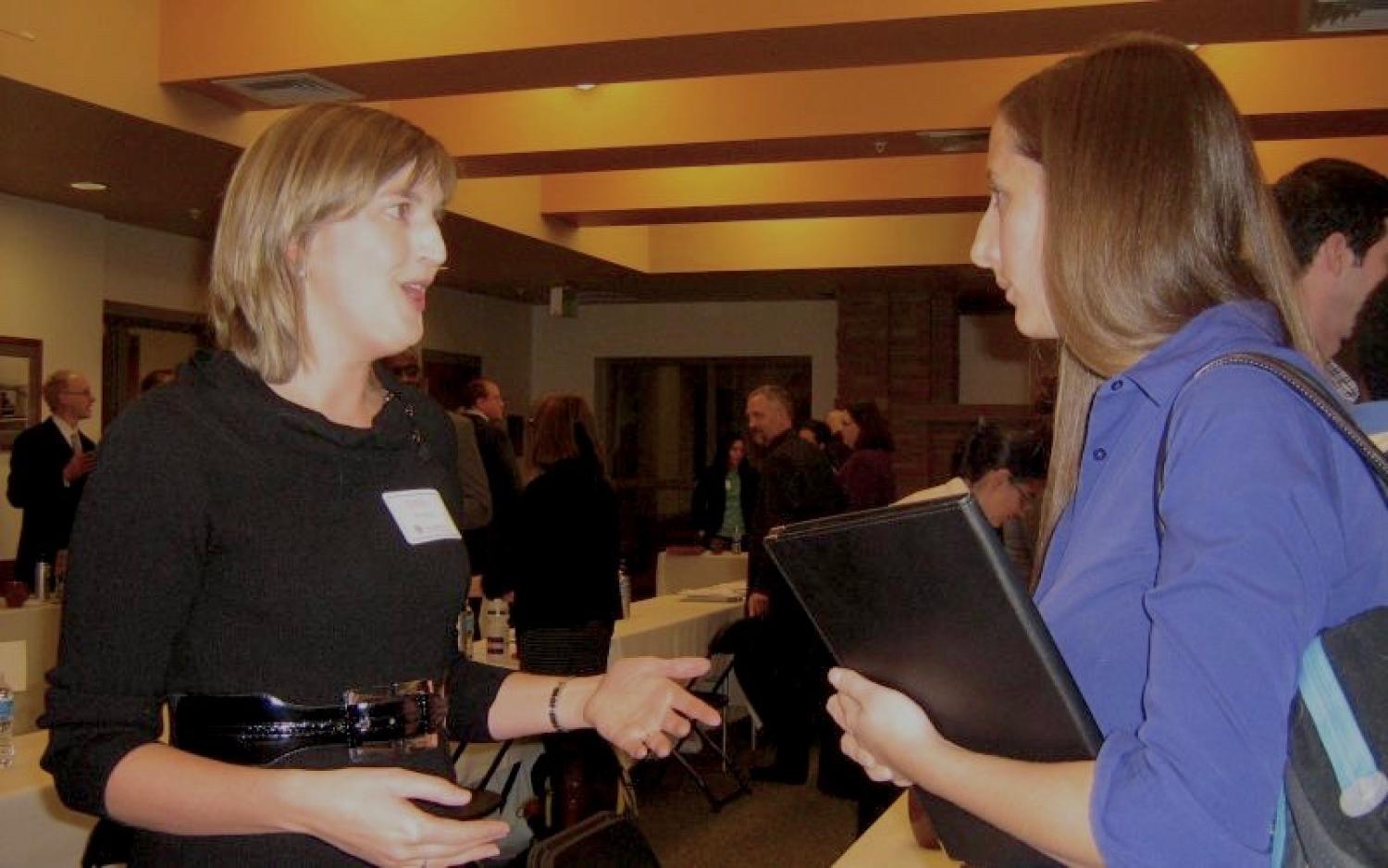 Emily Prehm from the U.S. Department of Health and Human Services, Office of Civil Rights talking with Colorado Law student Tessa DeVault (2013)
