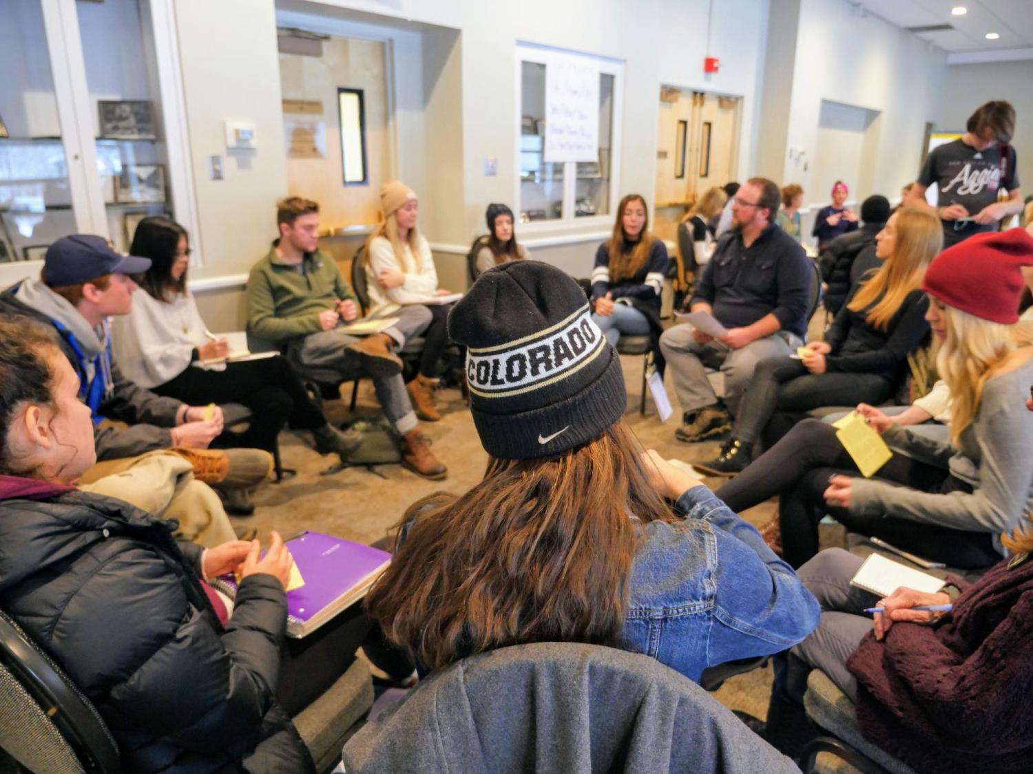 Diversity and Inclusion Summit attendees sit in a circle