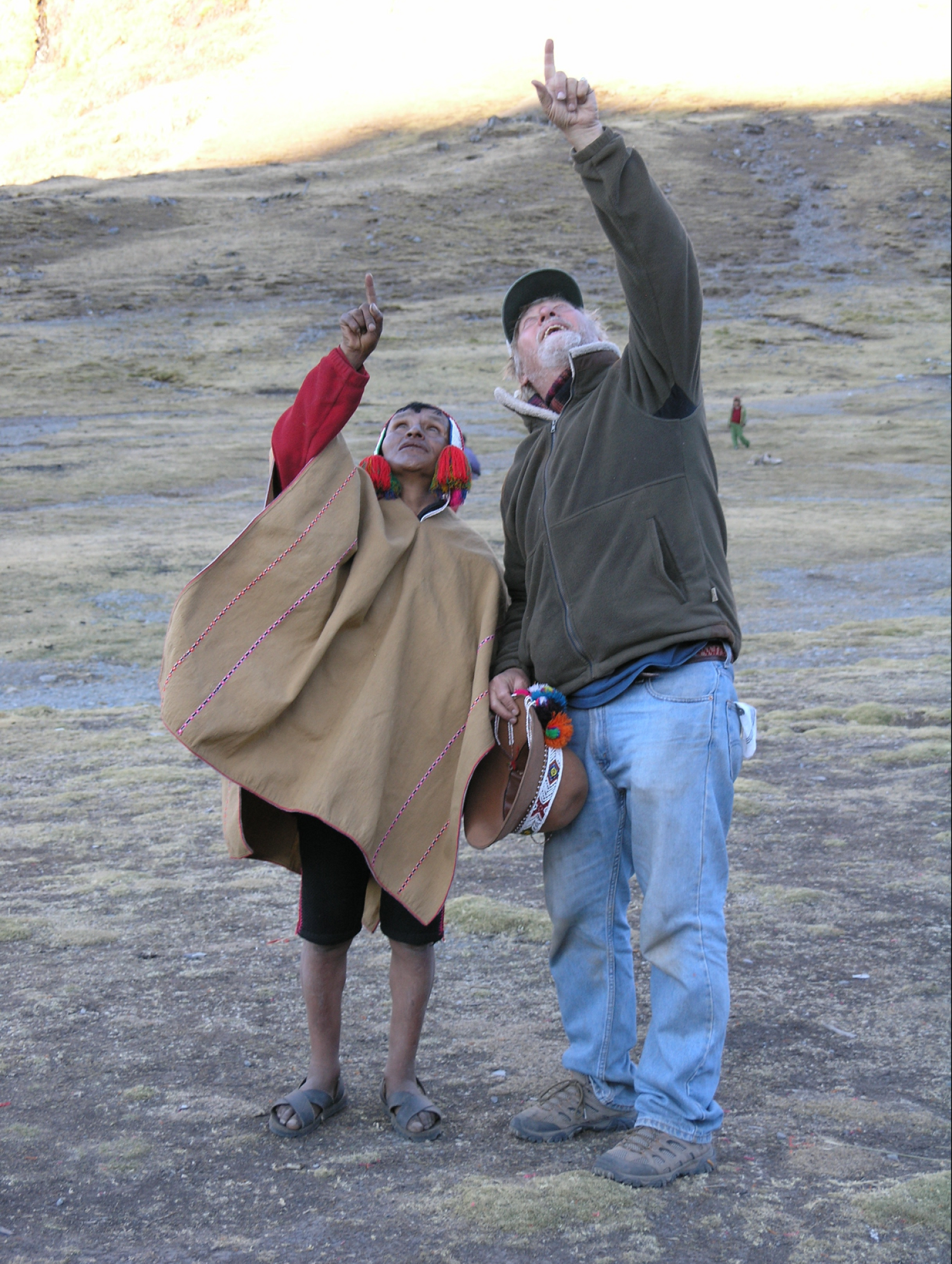 John Stocke points to the sky with a Q'ero tribe member