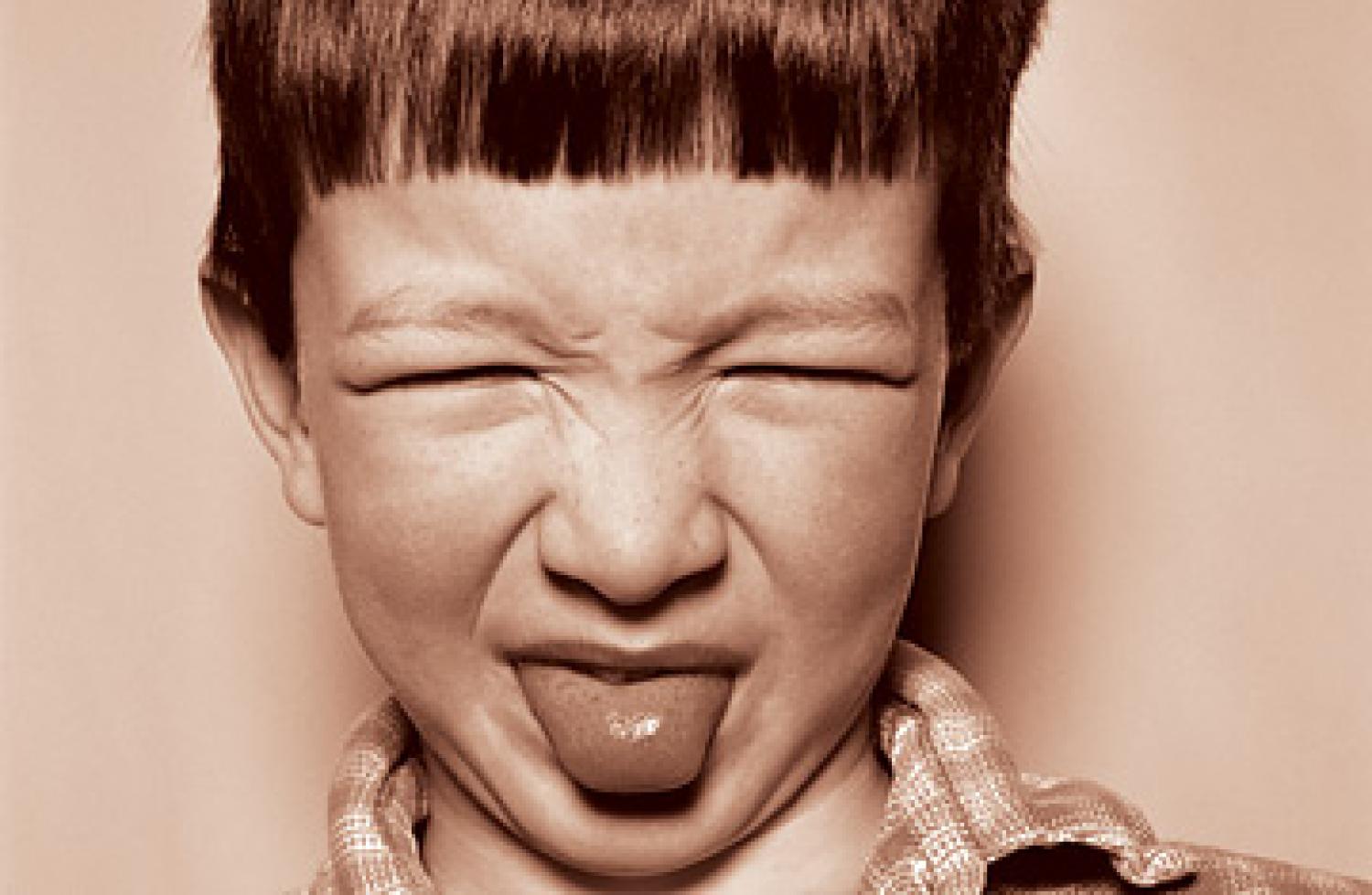A child with a disgusted face