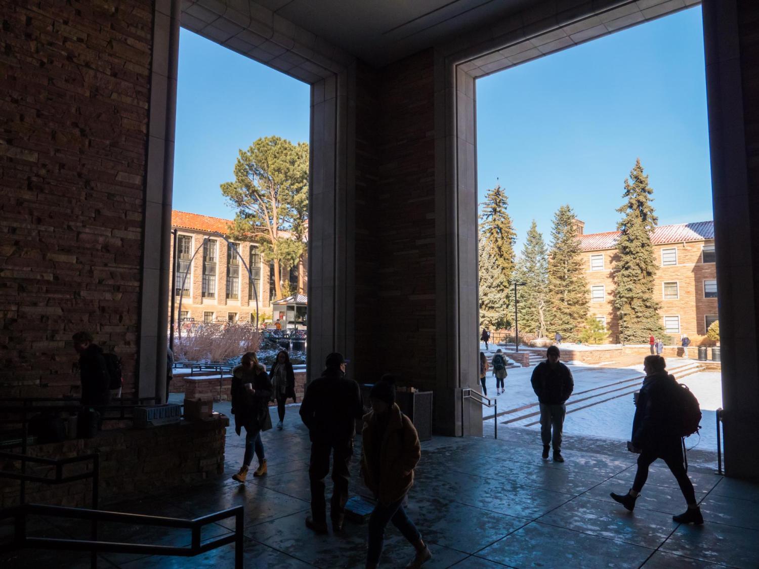 students walking on snowy campus