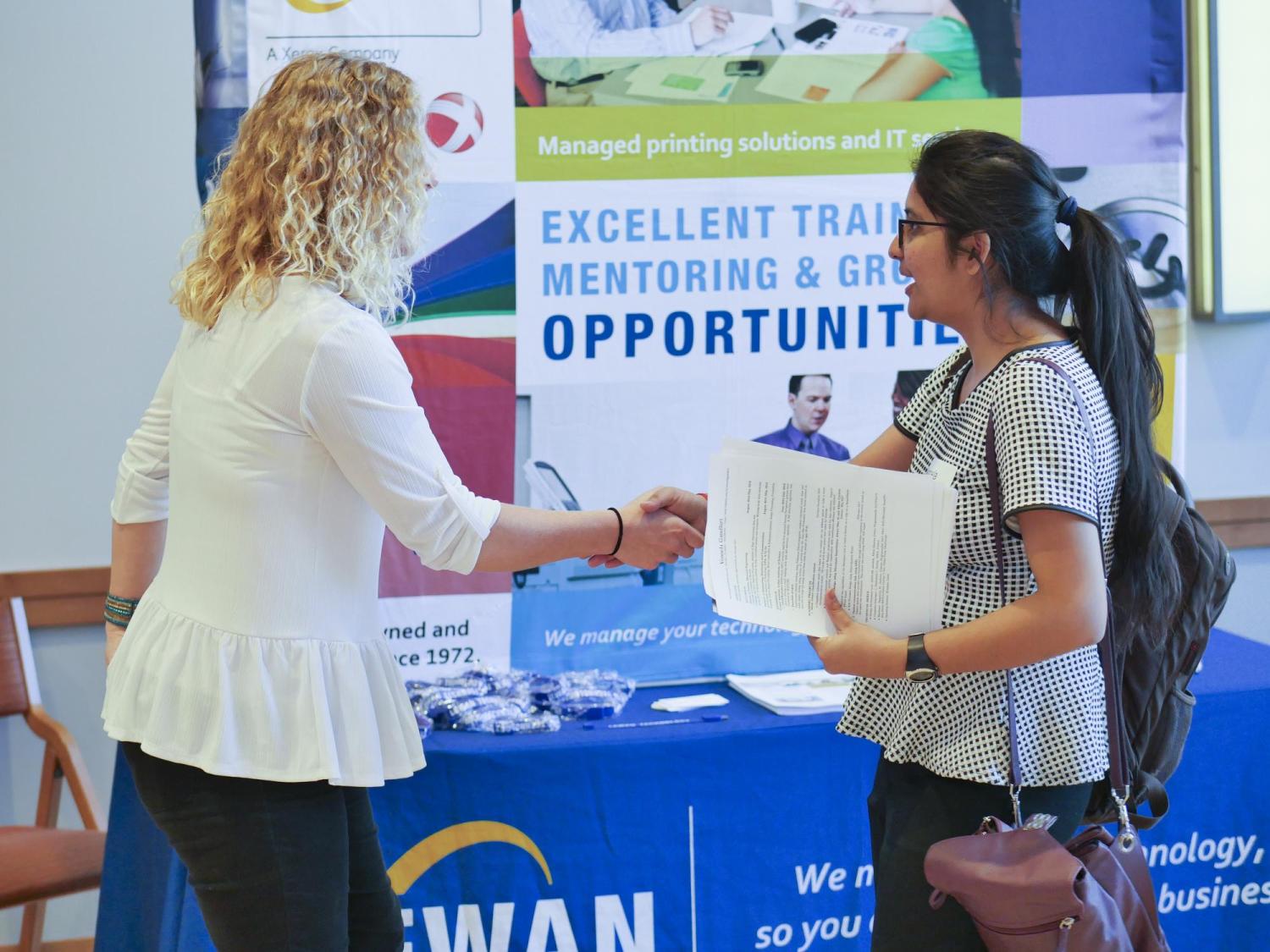 Student at a career fair on campus.