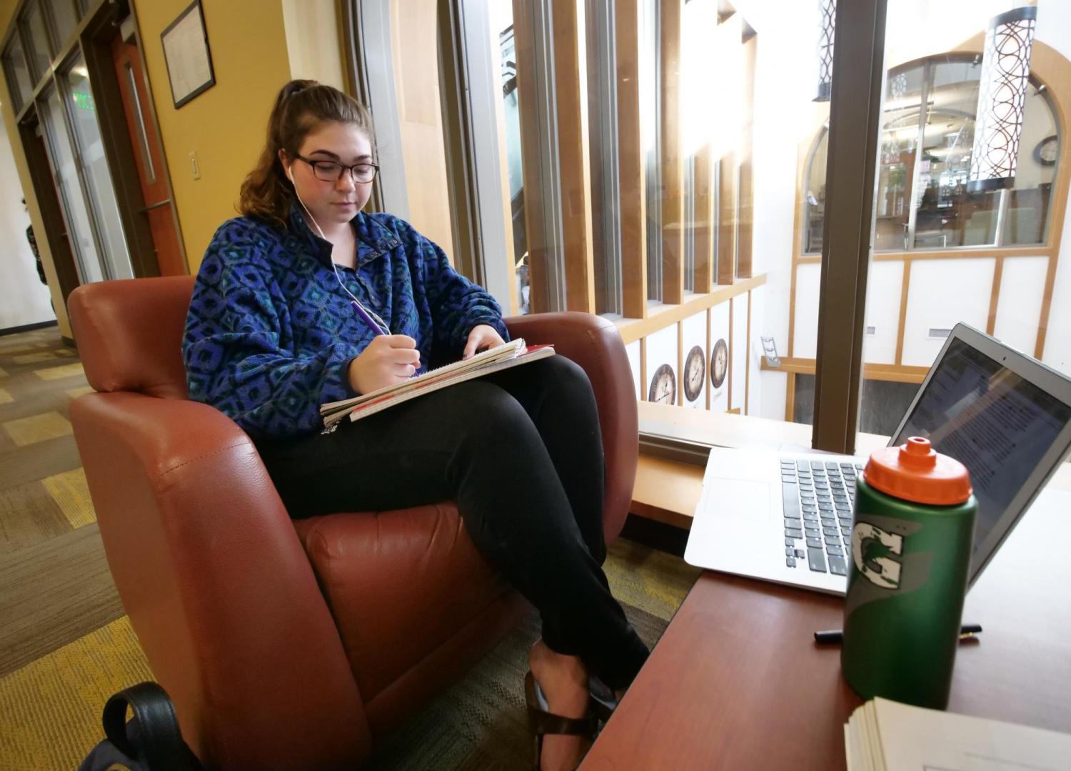Student studying in a CU dormitory lounge