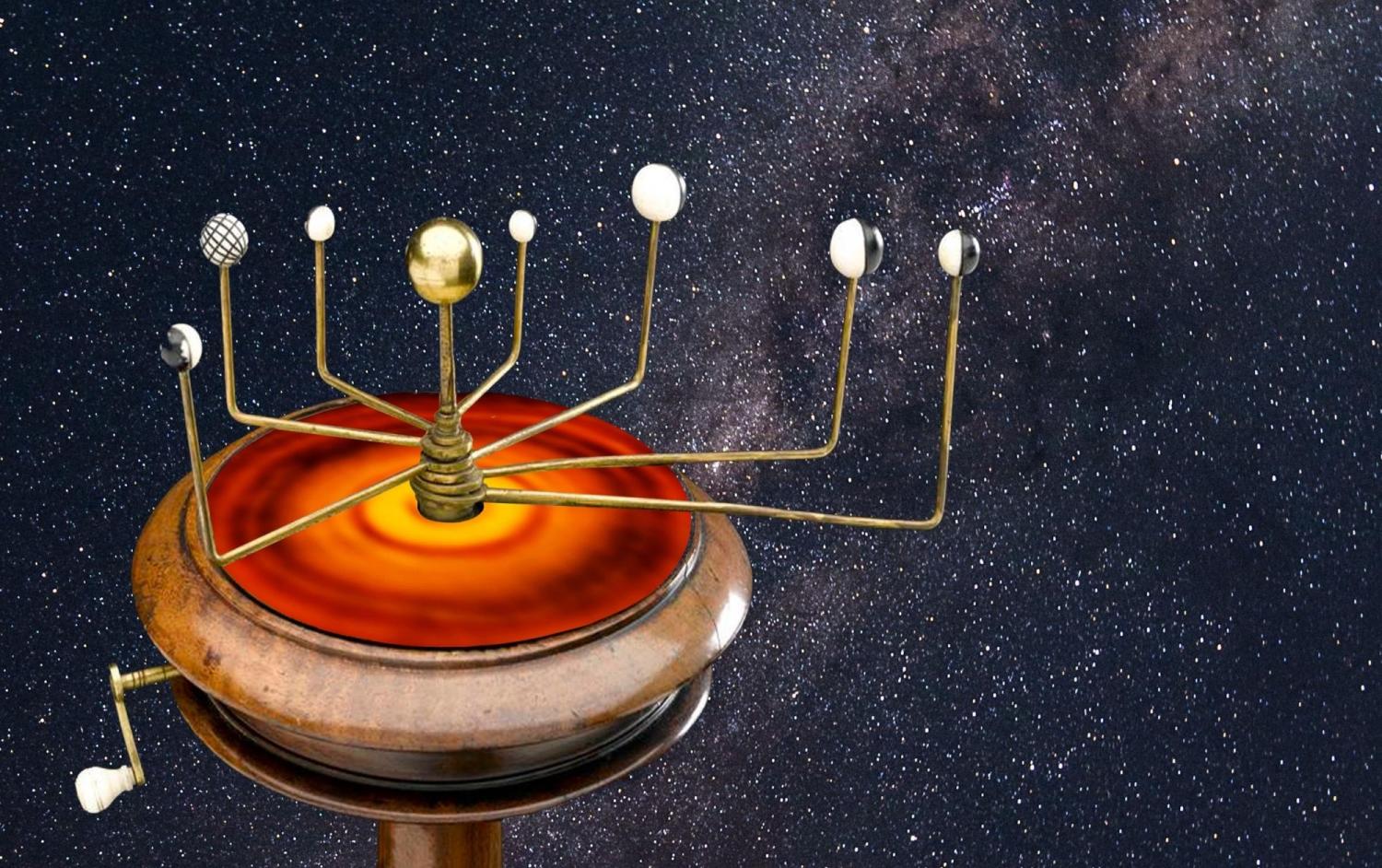 An orrery, a type of device once used to track the movements of the planets, sitting above an infrared image of a hypothetical "protoplanetary" disk that may have divided the solar system early in its history.
