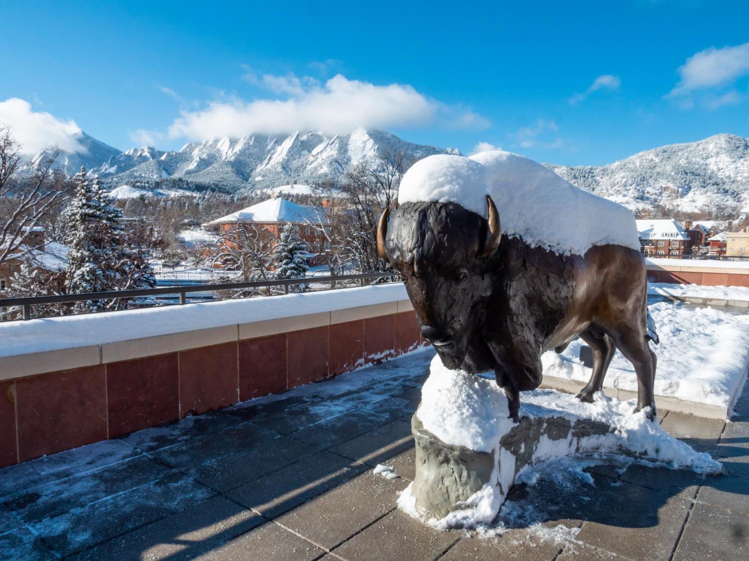 Ralphie sculpture with Flatirons in background
