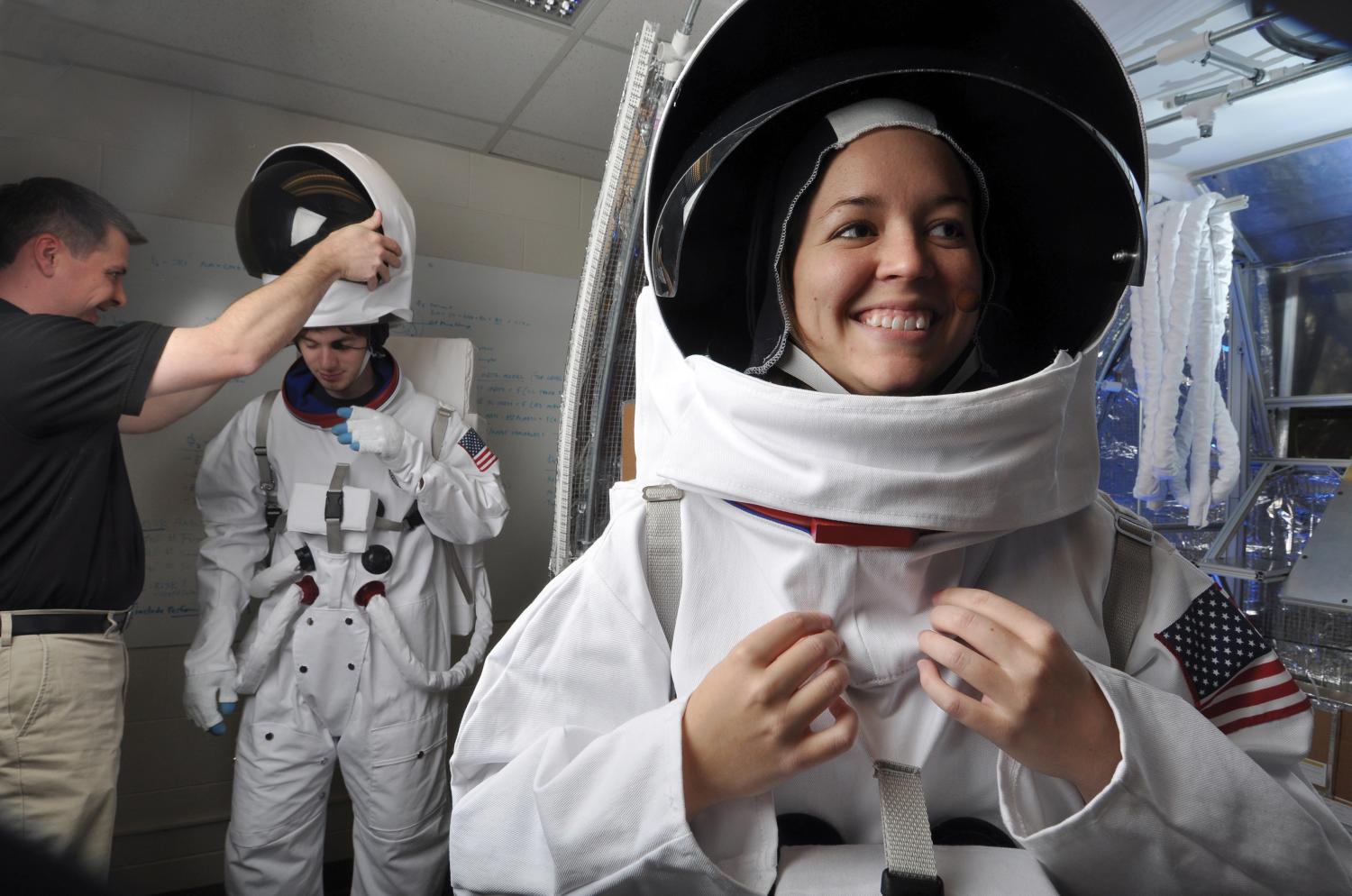 Students wearing space suits
