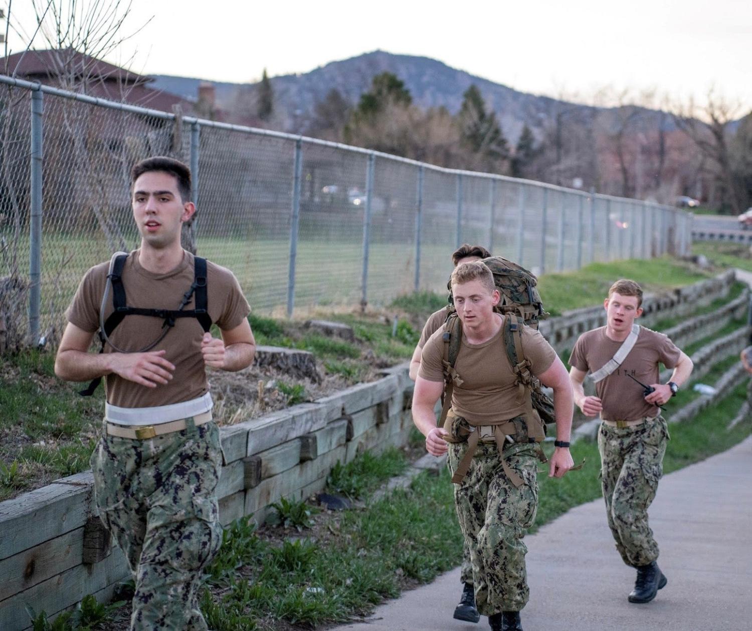 Midshipmen run from Folsom Stadium to Chautauqua Park as part of the sea trials exercise