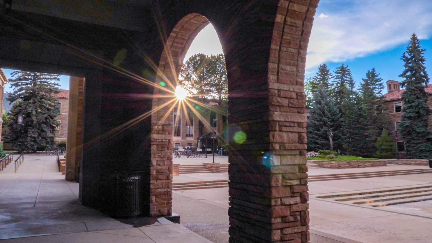 The sun shining over Norlin Library