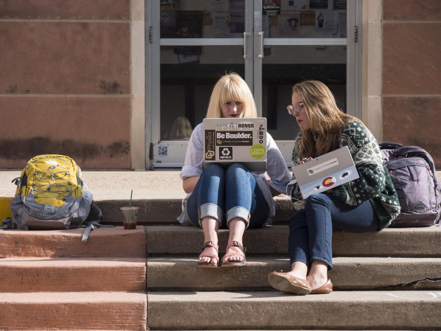 Students work on computers outside the ___