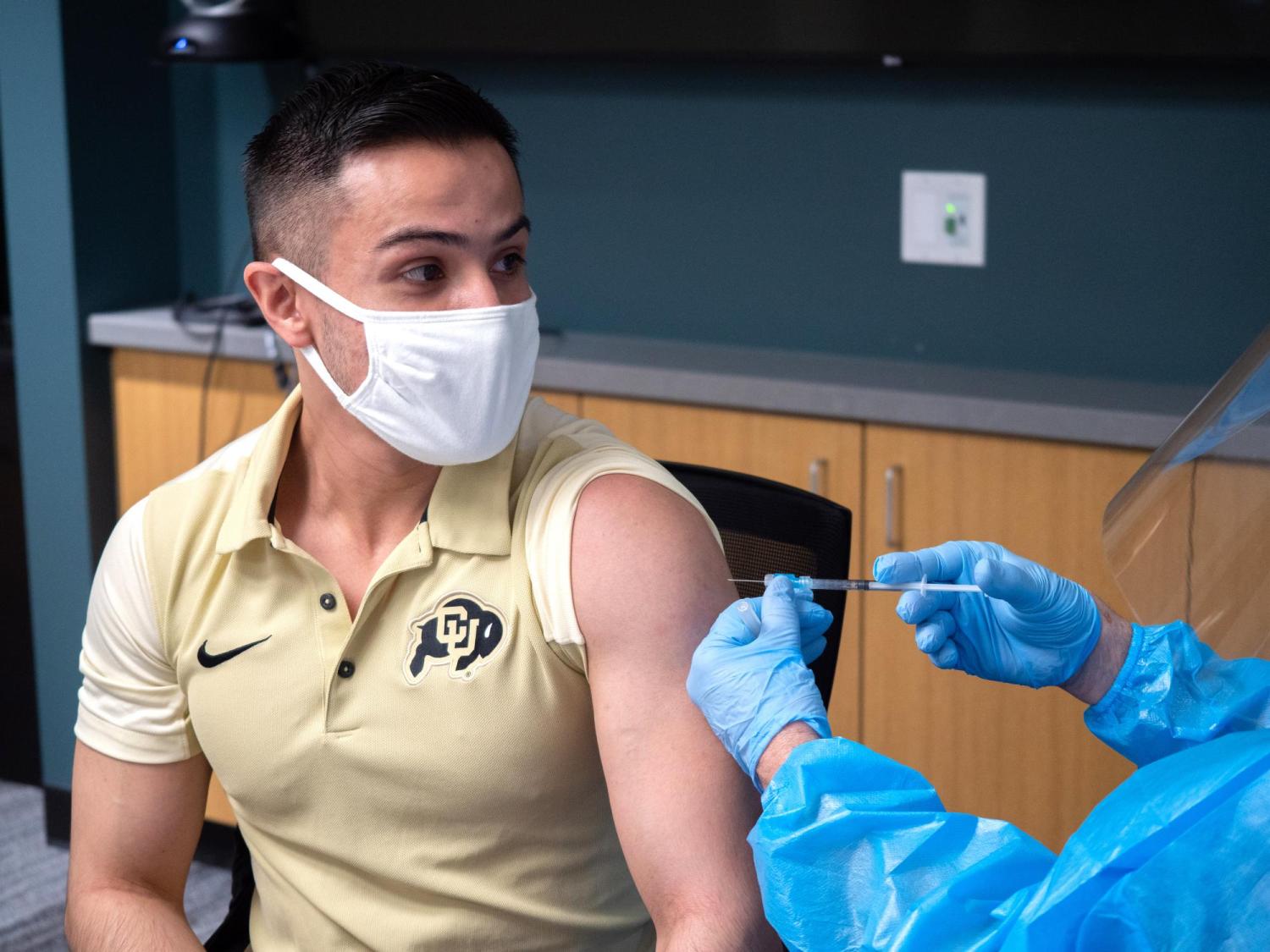 A student getting a vaccine