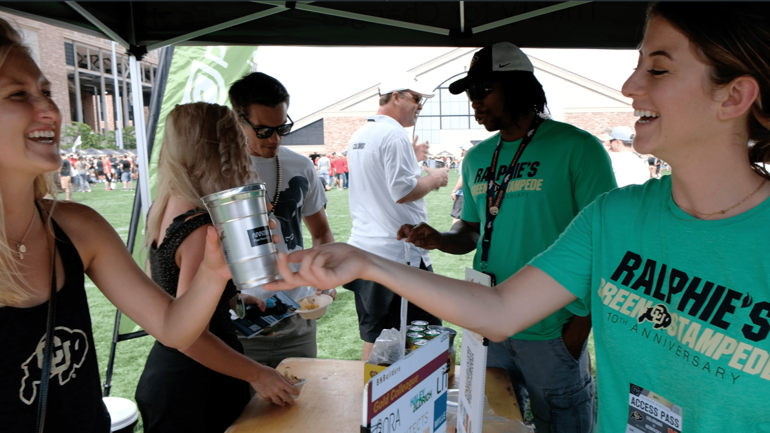 Ralphie's Green Stampede volunteers hand out reusable cups