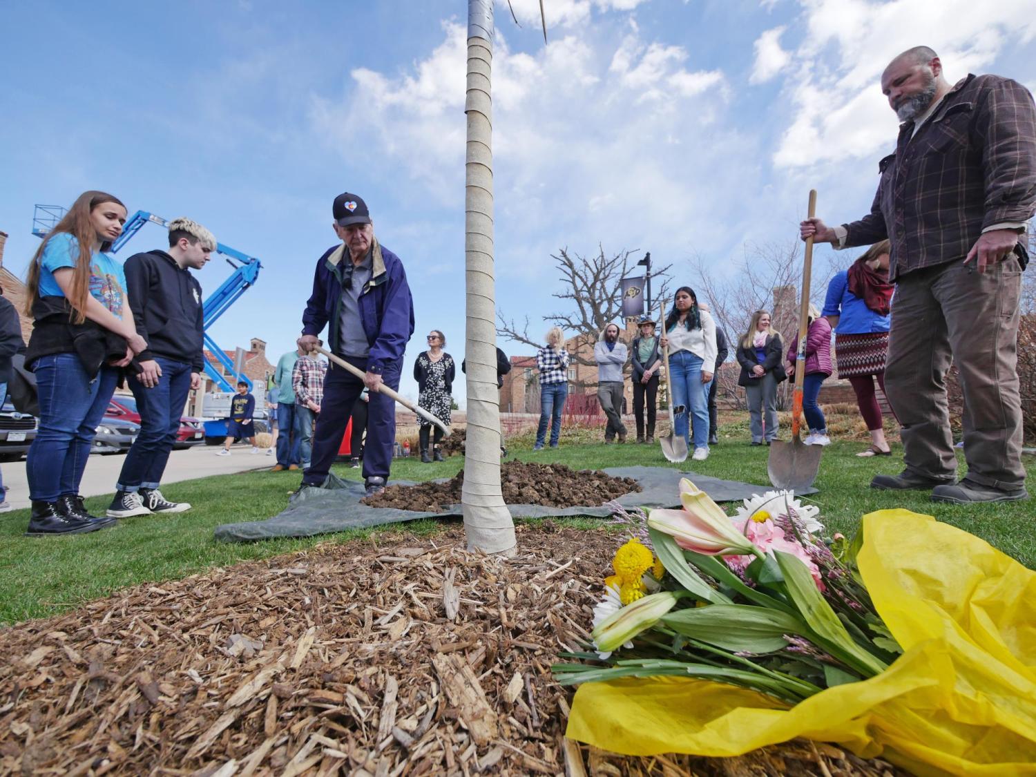 Tom Whittington, the father of shooting victim Teri Leiker, submits an offering during the dedication ceremony.