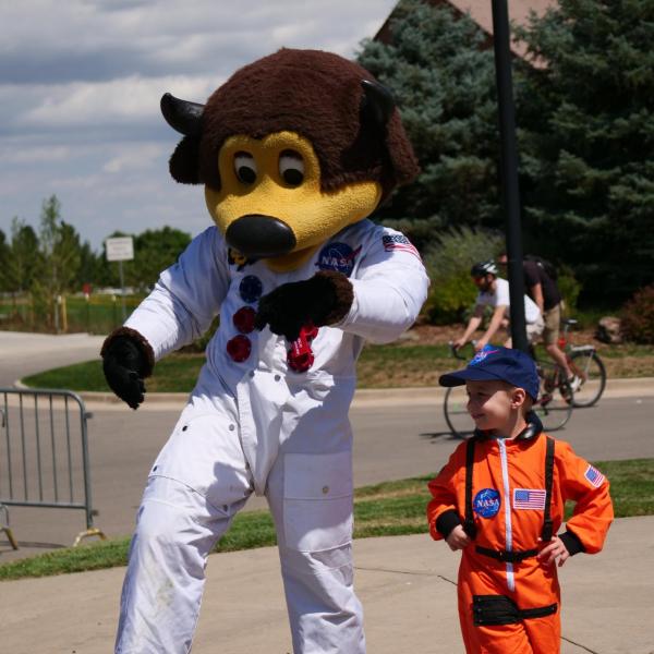 Chip and a future astronaut are seen at Monday's grand opening ceremony for the new Aerospace Engineering Sciences Building at CU Boulder. (Photo by Glenn Asakawa/CU Boulder)