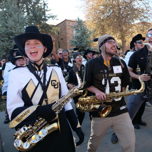 Members and alumni of the CU Marching Band perform during pre-game festivities for Homecoming weekend on the CU Boulder campus on Saturday, Nov. 9, 2019. (Photo by Glenn Asakawa/University of Colorado)