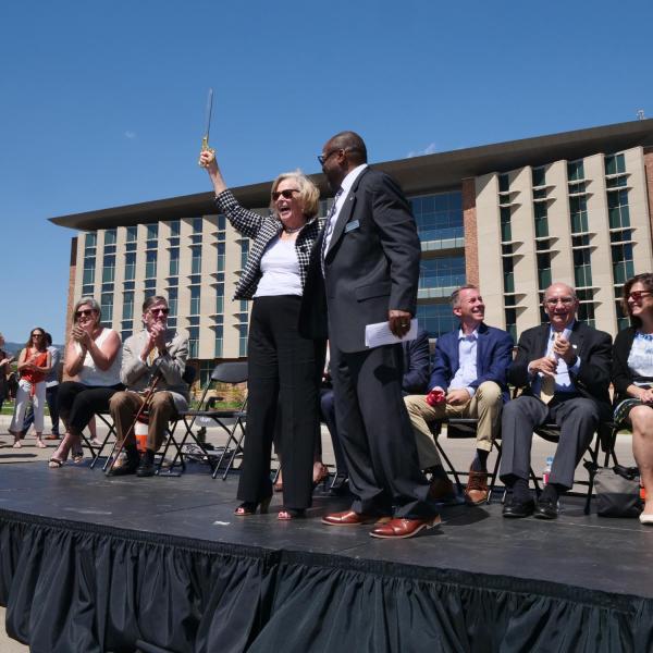 Ann Smead, left, and Brian Argrow, chair of the aerospace engineering department, pose following a ribbon-cutting ceremony at the new Aerospace Engineering Sciences Building at CU Boulder. (Photo by Glenn Asakawa/CU Boulder)