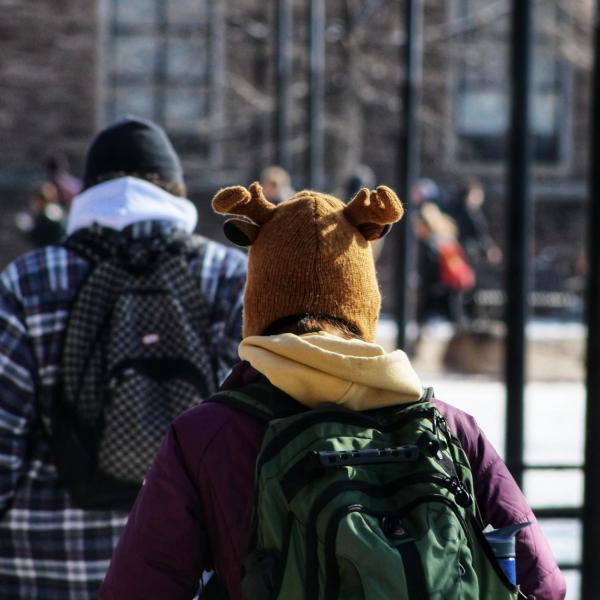 An unidentified Buff sports a cap of a different animal on the way to class on a chilly Friday morning. Photo by Glenn Asakawa.
