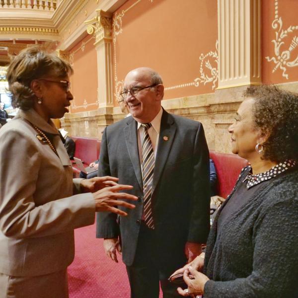 CU Boulder Chancellor Phil DiStefano, center, and professor Polly McLean, right, speak with State Senator Rhonda Fields.