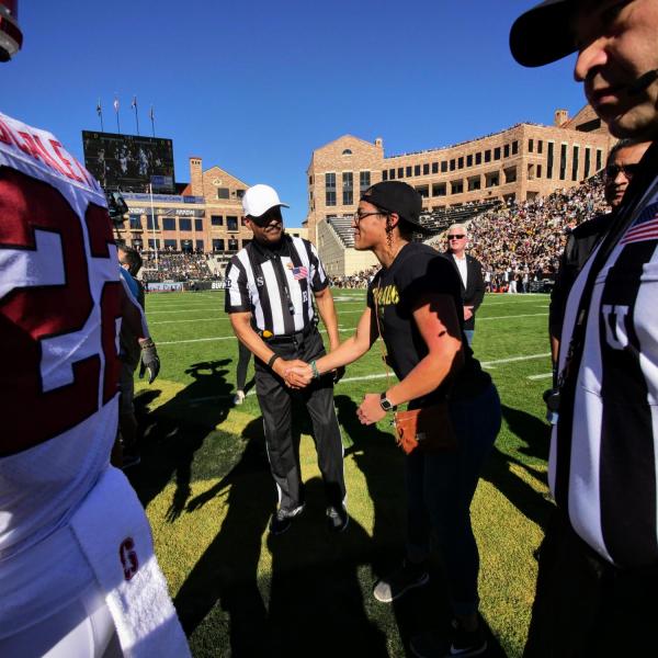 Student veteran Nisa Jovel participates in the coin toss at the start of the Colorado-Stanford football game on Saturday, Nov. 9, 2019. (Photo by Glenn Asakawa/University of Colorado)
