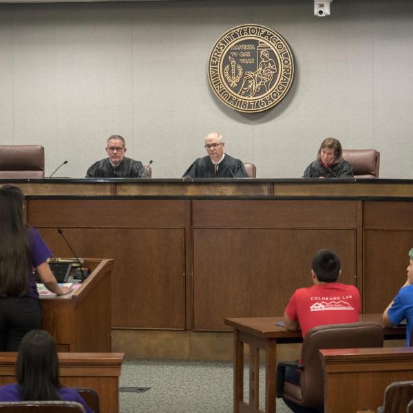 An esteemed panel of judges form the panel for the final round of the high school Moot Court competition at Colorado Law. Photo by Glenn Asakawa.