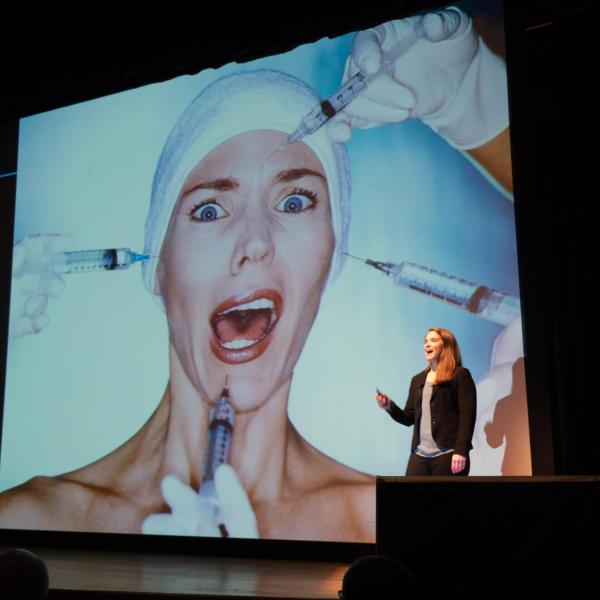Student Jeanne Barthold pitches her team's product, a lower-cost and longer lasting solution for those with tissue damage or aging. Photo by Glenn Asakawa.