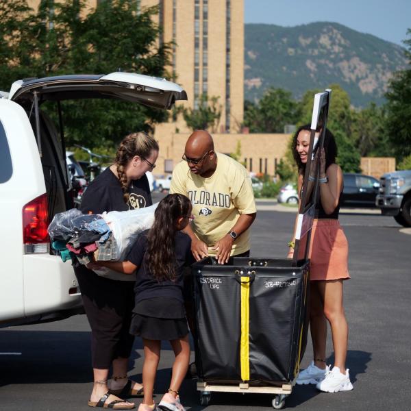 First-year students, parents, staff and volunteers welcome each other back on the CU Boulder campus in the Williams Village Complex on Monday, Aug.16, 2021. (Photo by Glenn Asakawa/University of Colorado)