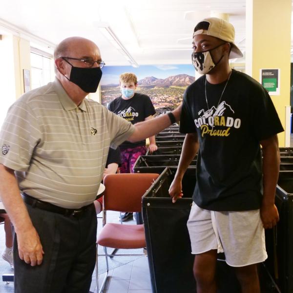 Chancellor Phil DiStefano greets parents, students and staff during a tour of Hallett Hall on the first day of Move-In on Monday, Aug. 16, 2021. (Photo by Glenn Asakawa/University of Colorado)