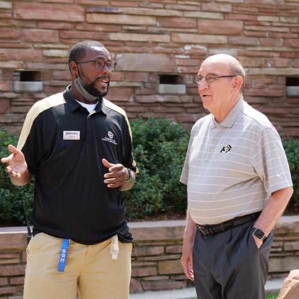 Chancellor Phil DiStefano meets with DeAndre Taylor, associate director for education initiatives for residence life, before a tour of Hallett Hall on Monday, Aug. 16, 2021. (Photo by Glenn Asakawa/University of Colorado)