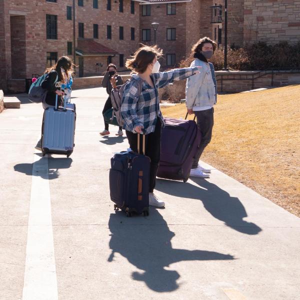 Students return to the Kittredge residence hall complex on Feb. 7, 2021, after studying remotely since the middle of January. (Photo by Glenn Asakawa/University of Colorado)