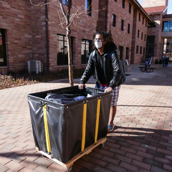 CU Boulder student Rohit Karri returns to the Kittredge Central residence hall on Feb. 7, 2021. (Photo by Glenn Asakawa/University of Colorado)