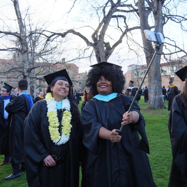 Students and faculty gather on the quad before processing to Folsom Stadium