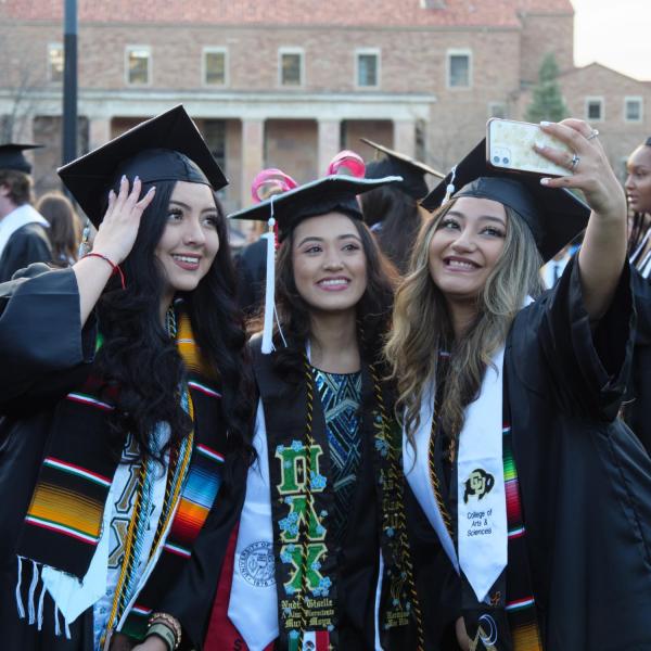 Students and faculty gather on the quad before processing to Folsom Stadium