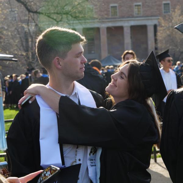 Students and faculty gather on the quad before processing to Folsom Stadium