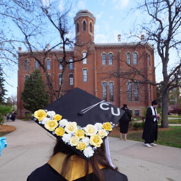 Students and faculty gather on the quad before processing to Folsom Stadium