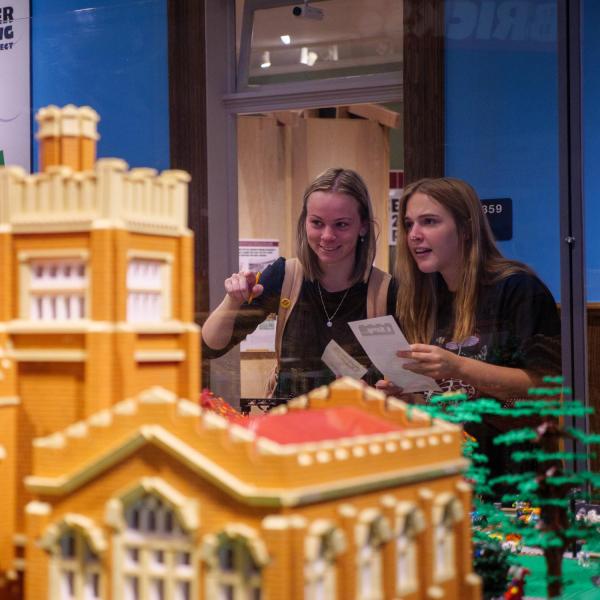 Campus community members explore the Lego exhibit at the Heritage Center