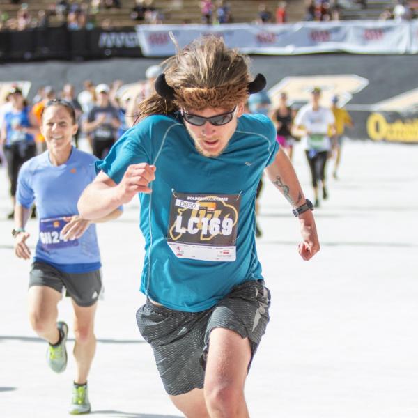 Participants finish up the race and celebrate at Folsom Field.