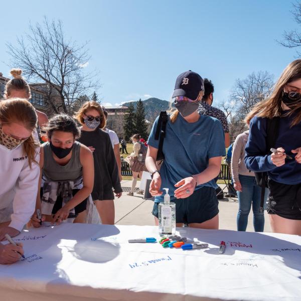 Students Demand Action at the University of Colorado Boulder host a rally on March 30 honoring the victims of the March 22, 2021 mass shooting in Boulder. (Photo by Patrick Campbell/University of Colorado)