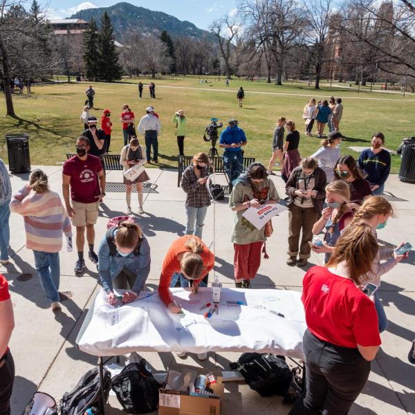 Students Demand Action at the University of Colorado Boulder host a rally on March 30 honoring the victims of the March 22, 2021 mass shooting in Boulder. (Photo by Patrick Campbell/University of Colorado)