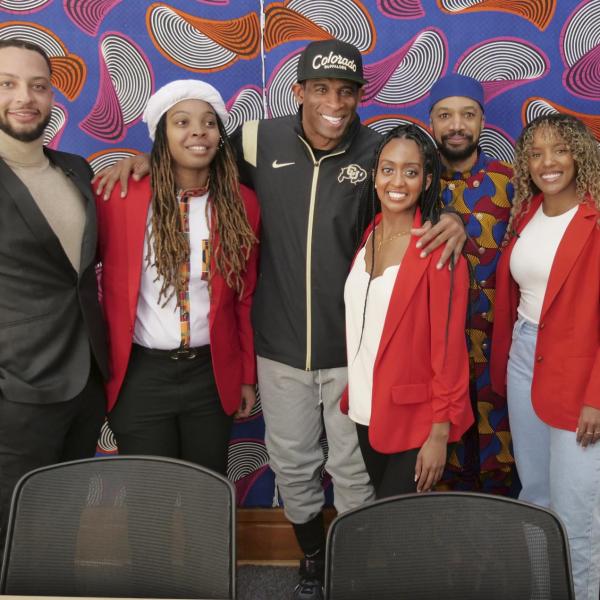 People pose for a photo, including Director Reiland Rabaka and Deion "Coach Prime" Sanders, at the CAAAS grand opening. (Casey A. Cass/University of Colorado)