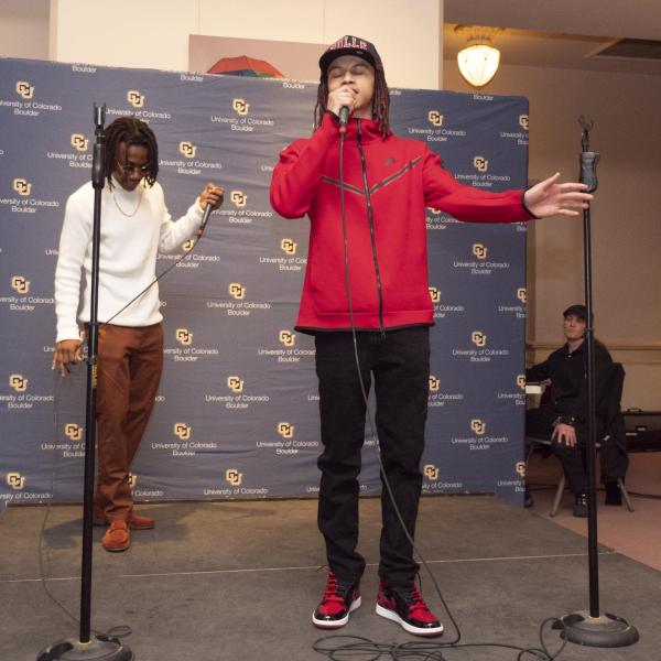 Manuel High School students Al Hassan Muhammad (at front in red) and Vishnu Gonzales give a hip-hop performance. (Casey A. Cass/University of Colorado)