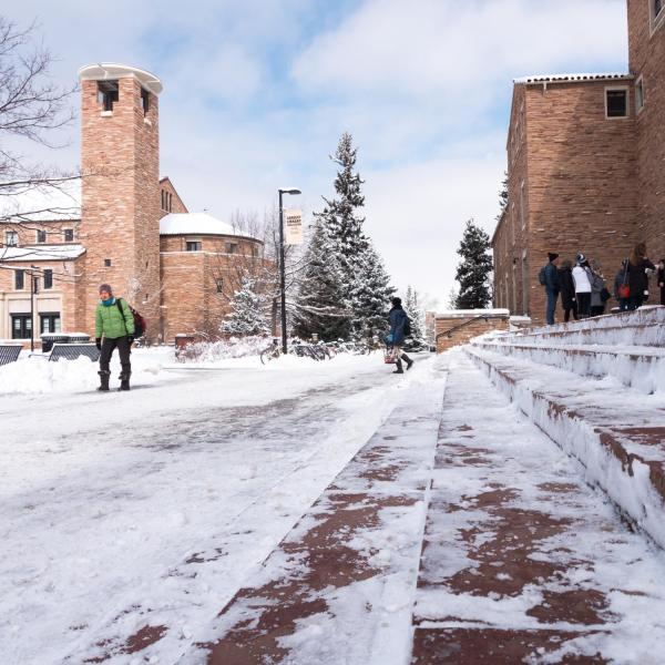 Campus community members trek across a snowy campus on Tuesday, Feb. 20. Photo by Patrick Campbell. 