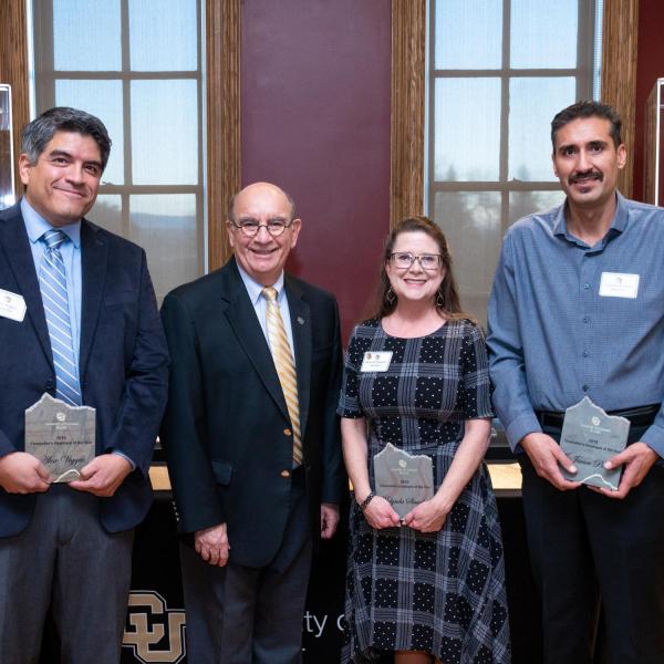 CU Boulder Chancellor Phillip DiStefano, center left, stands with winners of the 2019 Chancellor’s Employee of the Year Award. (Photo by Patrick Campbell/University of Colorado)