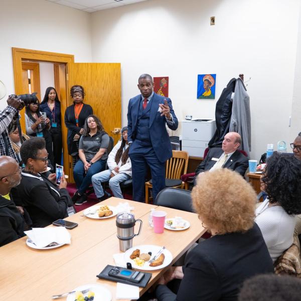 Deion Sanders speaks to members of the Colorado Black Caucus during a breakfast meeting