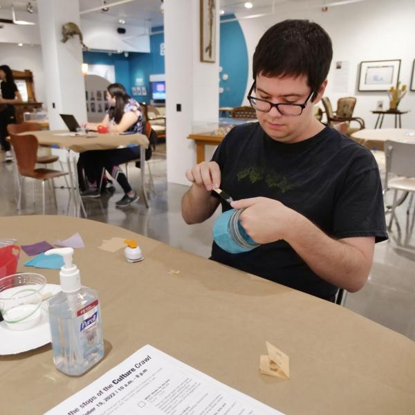 Campus community members participate in an activity in the CU Museum of Natural History's BioLounge